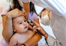 Close up of a pediatrician having a check up on her baby patient